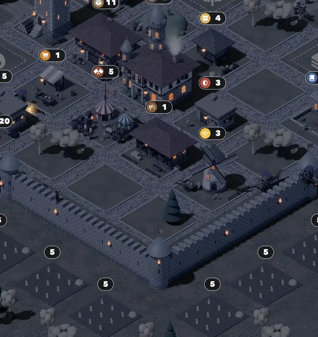 The village at night, lamps glowing along the lanes and the wall
